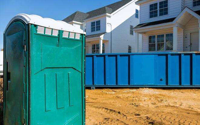 dumpster and portable toilet at a construction site project in El Paso TX